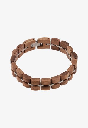 Bransoletka wykonana z prostokątnych drewnianych ogniw połączonych metalową taśmą z metalowym zapięciem, pokazana na białym tle.