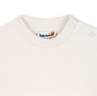 Crèmekleurige sweatshirt met geribbelde hals, twee drukknoopjes op de schouder en een Timberland-label binnenin de kraag. Zacht katoenmateriaal.