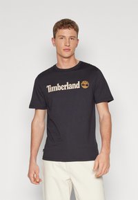 Timberland - KENNEBEC RIVER LINEAR LOGO SHORT SLEEVE - Triko s potiskem - black Miniatura obrázku 1