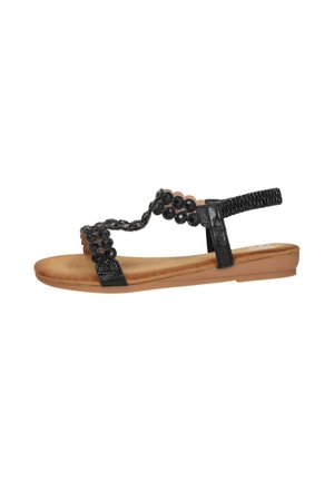 Zwarte platte sandaal met kralenversierde bloemenbandjes, beige gewatteerde zool en elastisch achterbandje voor een goede pasvorm.
