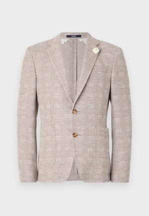 Textured light beige blazer with two buttons, notched lapels, front pockets, and a decorative white brooch on the left lapel.