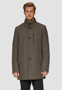 Bruine houndstooth wollen jas met hoge kraag, frontsluiting met knopen en zijzakken. Heeft een ritssluitingzak op de borst.