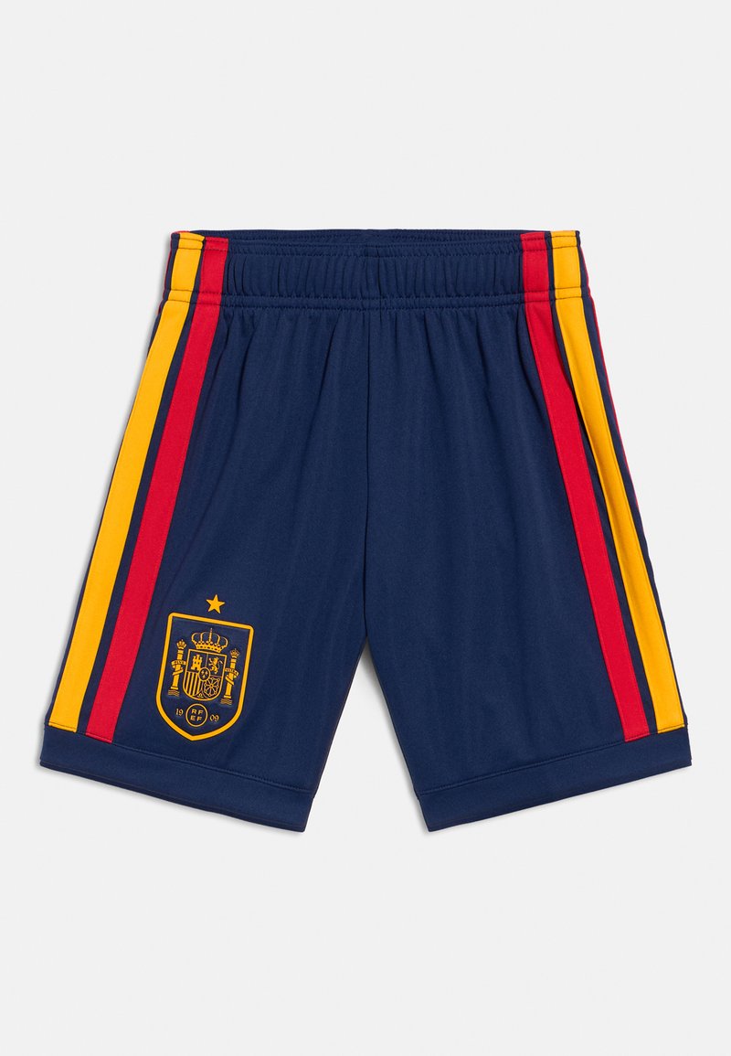 Tumsas zils sporta šorti ar dzeltenām un sarkanām sānu svītrām, ar elastīgu jostu, ar zeltainu Spānijas komandas emblematu kreisās apakšējās kājas pusē.