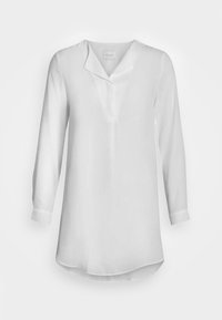 Vit långärmad blus utan krage, med knäppning och knäppta manschetter. Tillverkad av lättviktsmaterial med en mjuk textur.