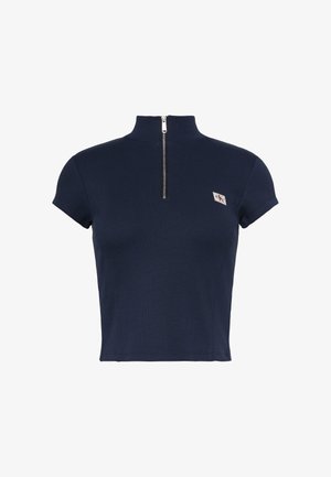 Haut court bleu marine à manches courtes avec col montant, fermeture éclair argentée à l'avant et petit écusson du logo CK sur la poitrine gauche.