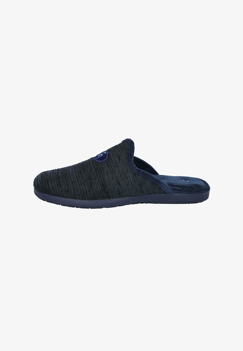 Zapatilla oscura de felpa azul marino, con tela texturizada, punta redonda y un interior suave, que presenta un acento de logo circular en el costado.