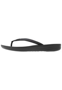 Tongs noires avec une lanière texturée, une semelle rembourrée et un design épuré et minimaliste. Convient pour un usage décontracté.
