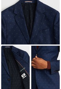 Navy blue blazer with a patterned texture, single button, notched lapels, and two front pockets. Lined interior features a subtle design.