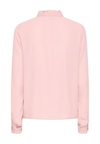 Long-sleeve blouse in soft pink fabric with a ruffled collar and buttoned cuffs. Smooth texture, simple design with no visible patterns.