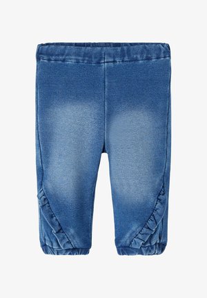 Niebieskie legginsy dla malucha z elastycznym pasem i mankietami, ozdobione falbankami wzdłuż zewnętrznych szwów nogawek.