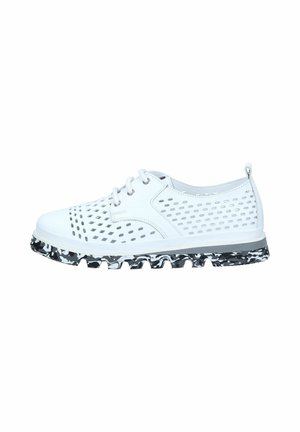 White casual lace-up shoe with perforated sides and black-and-white patterned rugged sole.