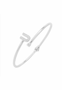 Brazalete de plata con diseño en forma de U, adornado con pequeños cristales transparentes. Forma elegante y minimalista con una textura suave.