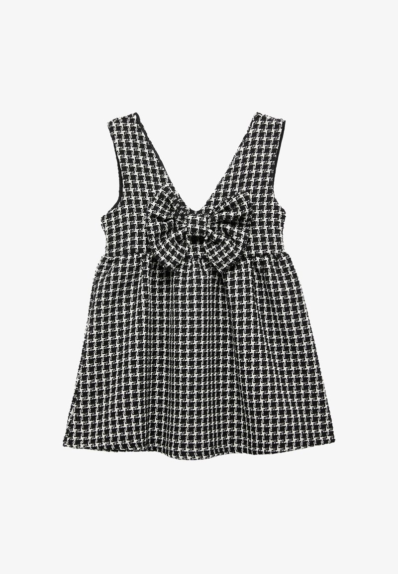 Ärmelloses schwarz-weiß kariertes Kleid mit V-Ausschnitt und einer großen Schleifendetail an der Taille, aus einem strukturierten Stoff gefertigt.