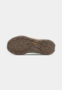 Terrengløpesko outsole i brunt gummi med dype, aggressive dekkmønstre for godt grep. Har en strukturert overflate og Continental-logo.