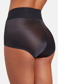 Svarta hipster trosor i ett mjukt, semi-transparent tyg. Har en bred, elastisk midjeband och rena kanter för en sömlös look.