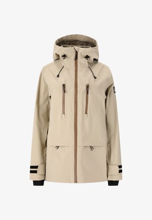 Beige vattentät jacka med huva, dragkedja fram, två bröstfickor, justerbara snörningar och svarta och vita randiga ärmslut.