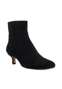 Black suede ankle boot with a tapered toe, low kitten heel, and seamless upper design. Features understated elegance with smooth texture.