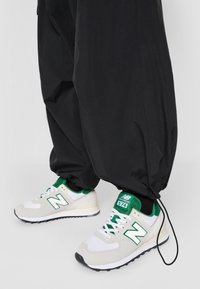 New Balance PANT - Παντελόνι cargo - black
