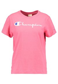 Vaaleanpunainen puuvillapaita, jossa on lyhyet hihat ja pyöreä kaula-aukko. Rinnassa on valkoinen "Champion"-logo, jossa on sinisiä yksityiskohtia. Tasainen rakenne.