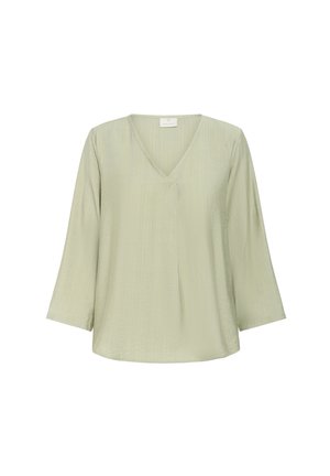 Blusa verde chiaro con scollatura a V, maniche a tre quarti e un tessuto texturizzato con una leggera lucentezza. Taglio semplice e rilassato.