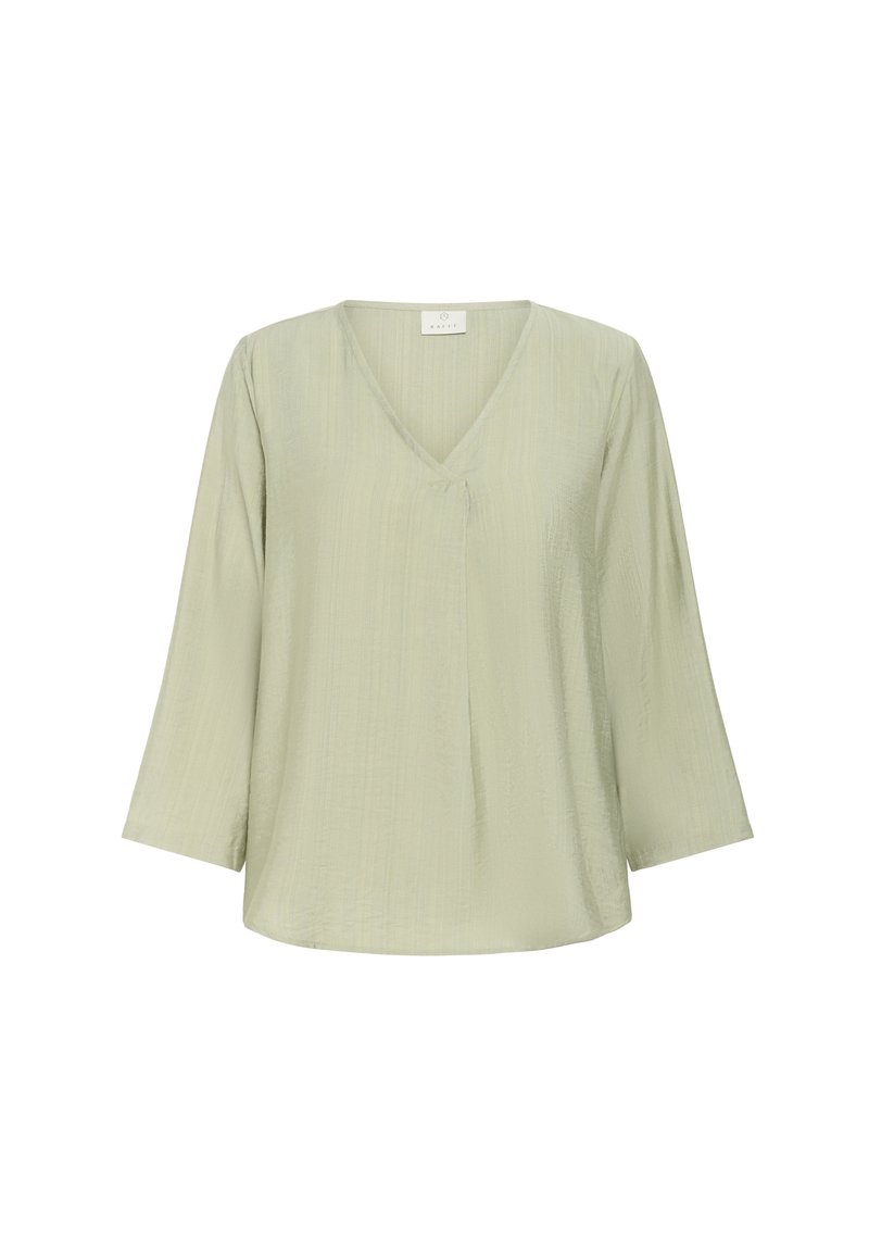 Blouse vert clair à manches longues avec col en V et coupe décontractée, en tissu léger texturé.