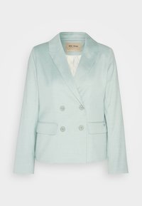 Vaaleansininen kaksirivinen bleiseri lovikauluksella, kahdella etutaskulla ja vastaavilla napeilla. Kankaan pinta on teksturoitu ja sileä.