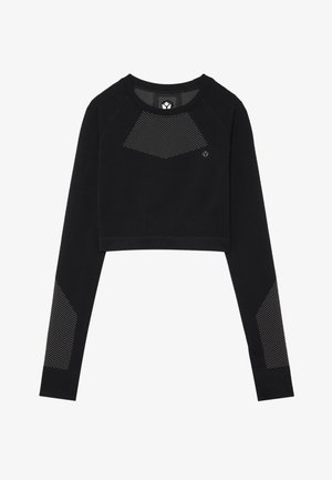 Fekete, rövid fazonú pulóver puha anyagból. Hálós panelek találhatók a mellkason és az ujjakon. Kerek nyakkivágás és hosszú ujjak jellemzik.