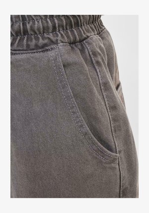 Gray cotton pants with a brushed texture, featuring an elastic waistband and side pockets, highlighted by visible stitching details.