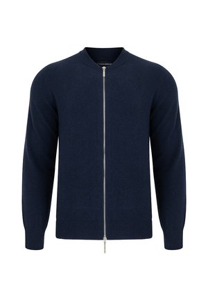 Granatowy kardigan zapinany na zamek, wykonany z teksturowanej dzianiny, z okrągłym dekoltem, długimi rękawami oraz prążkowanymi mankietami i do łem. Wykończenie w postaci srebrnego zamka.