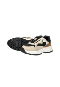Sneakers met een bovenwerk van beige en zwarte leder, groene accenten, dikke witte zool en een gestructureerde zwarte rubberen loopzool; vetersluiting.
