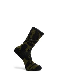 Chaussette noire et vert olive avec motif abstrait de feuilles, longueur mi-mollet, et petit logo blanc sur le côté sur fond blanc.