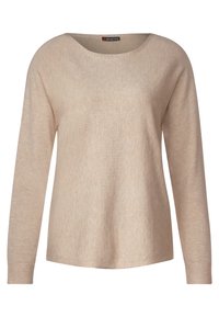 Pull à manches longues beige clair, texture douce, col rond, coupe décontractée, présentant des variations subtiles de couleur, avec une étiquette visible à l'intérieur.