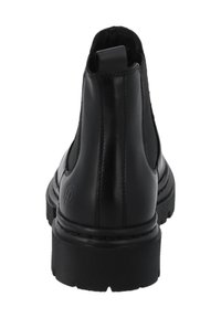 Stivaletti neri in pelle con pannelli laterali elasticizzati, punta arrotondata e suola in gomma texturizzata. Presentano un logo impresso sul tallone.