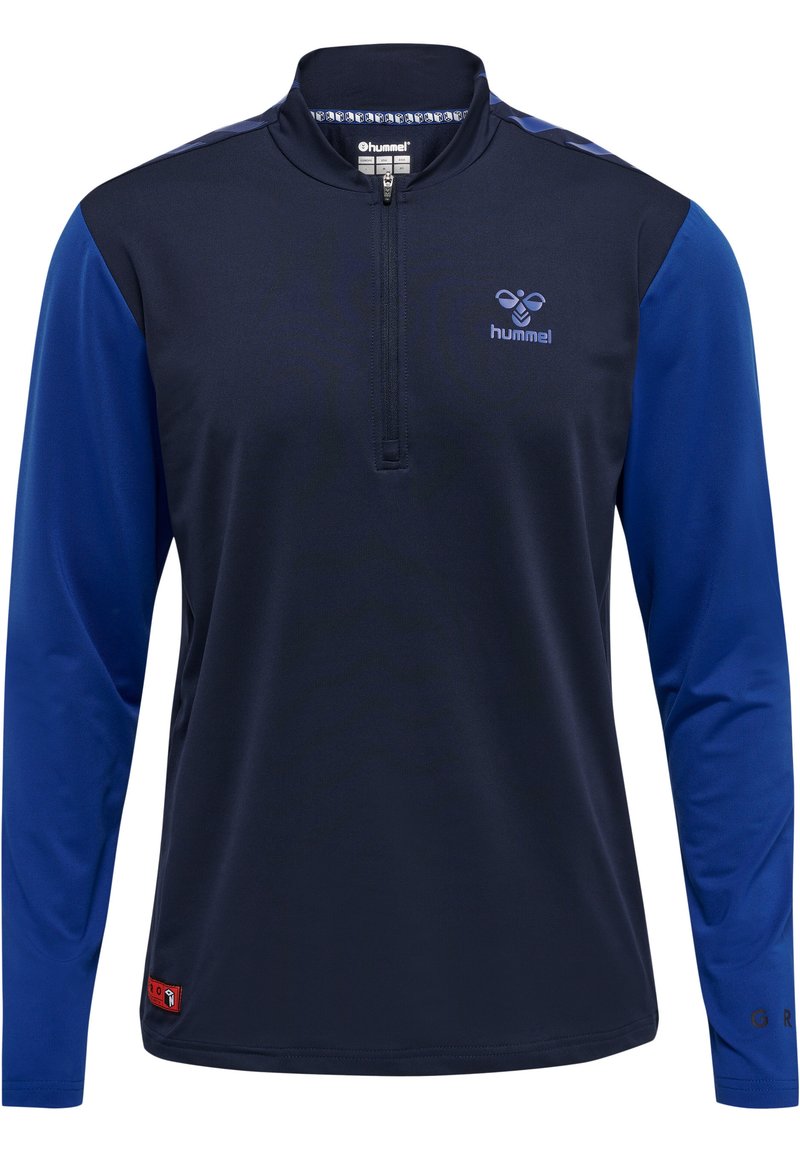 Marinblå långärmad skjorta med kvartdragkedja, blå detaljer på ärmarna och en liten logotyp på bröstet. Tillverkad av ett mjukt tyg.