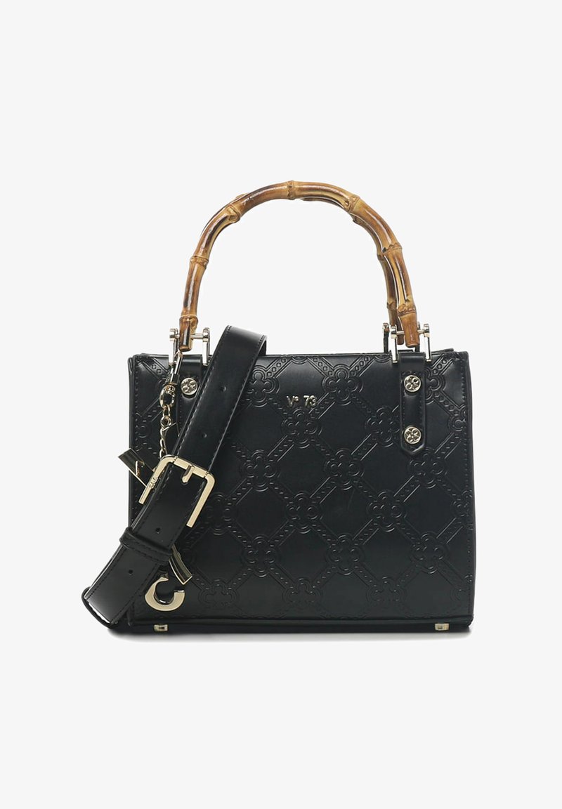 Sac à main en cuir noir avec anse en bambou, design floral en relief, bandoulière amovible et accents en métal doré.