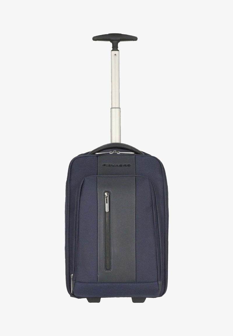 Valise roulante bleu marine avec une poignée escamotable, deux compartiments zippés et un tissu texturé. Comprend une poche zippée latérale et des roues robustes.