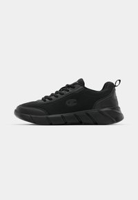 Black athletic sneakers featuring a mesh upper, reinforced toe, textured midsole, and rear pull tab for easy wear. Logo displayed on side.