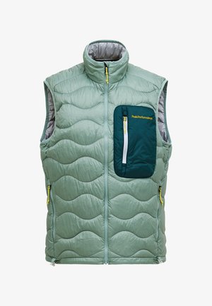 Lichtgroene gewatteerde mouwloze bodywarmer met hoge kraag, voorrits en donkergroene rits op de borst, geborduurd met gele "Peak Performance".
