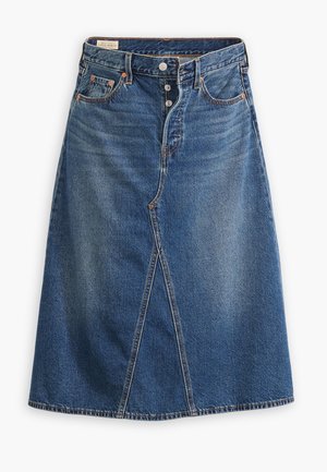 Jupe en denim à bleu délavé moyen avec une forme évasée, fente à l'avant, cinq poches et fermeture à boutons à la taille.