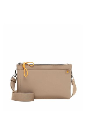 Beige crossbody bag with a detachable strap, front pocket, zipper closure, and small orange logo patch on the upper right corner.