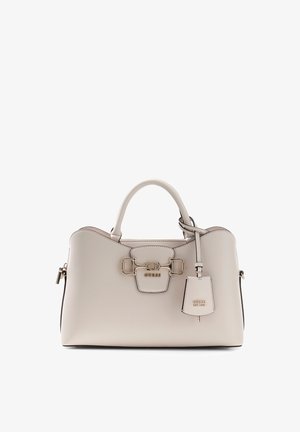 Beige leather Guess handbag with rounded handles, gold-tone hardware, and a hanging key tag embossed with the brand name.
