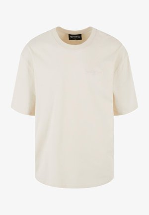 Crème katoenen t-shirt met korte mouwen, een ronde hals en een geborduurd "Dropsize" label op de voorkant. Eenvoudig, ontspannen pasvorm ontwerp.