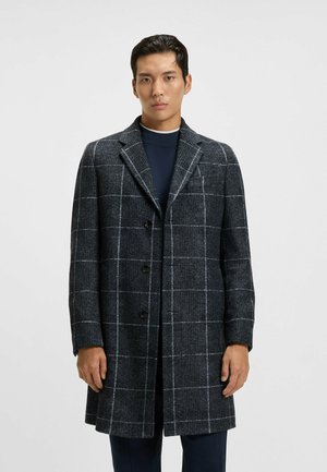 Karierte Überjacke in Dunkelgrau mit weißem Gittermuster, einreihiges Design, Reverskragen und drei Knöpfen. Texturiert und tailliert.