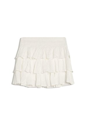 Bielá mini sukňa s viacvrstvovými volánmi, širokým elastickým pásom a textúrovanou látkou.