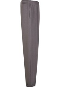 Pantalones de chándal grises con cintura elástica, que cuentan con un bolsillo lateral y un diseño ajustado. Hechos de una tela suave y elástica.