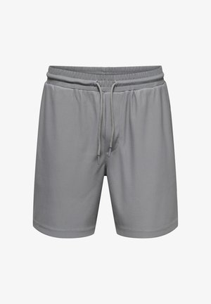 Shorts de sport gris en tissu côtelé, dotés d'une taille élastique avec cordon de serrage, et d'une coupe standard avec des ouvertures latérales.
