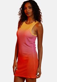 Sleeveless dress featuring a gradient design transitioning from yellow to pink to orange. Made of lightweight, textured fabric.