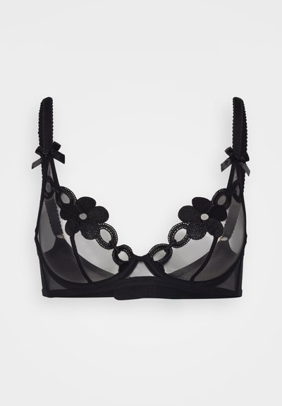 Sujetador de encaje negro con copas de malla transparente, motivos florales decorativos, bordes con forma de concha y tirantes ajustables con lazos.