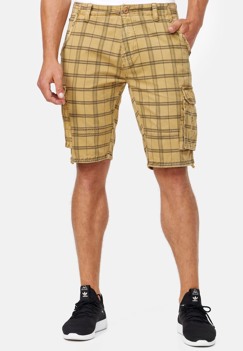 Kahki plaid cargo shorts with multiple pockets, a button closure, and a relaxed fit, featuring dark lines on a lighter background.
