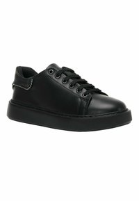 Zapatillas negras de cuero suave con punta redonda, diseño de cordones y suela de goma texturizada. Cuenta con un acento decorativo plateado en el lateral.